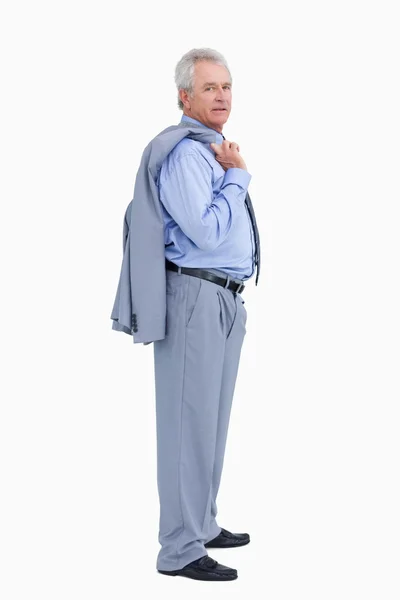 Side view of mature tradesman with his jacket over his shoulder — Stock Photo, Image
