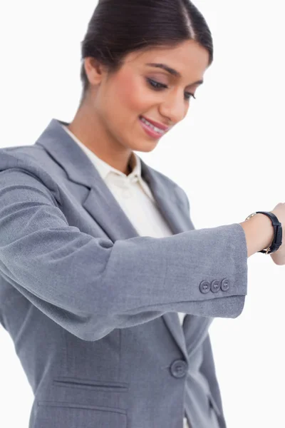 Close up of female entrepreneur looking at watch — Stock Photo, Image