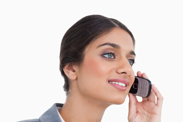 Close up side view of female entrepreneur on her cellphone — Stock Photo, Image