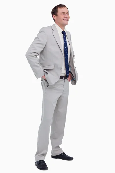 Smiling businessman with hands in his pockets — Stock Photo, Image