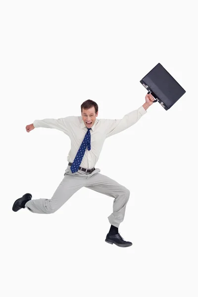 Cheerful jumping businessman with his suitcase — Stock Photo, Image