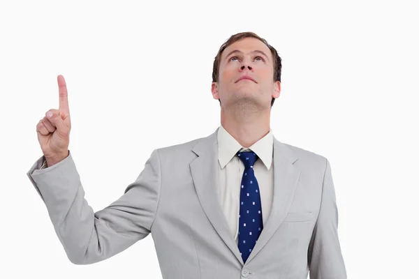 Close up of businessman pointing and looking up — Stock Photo, Image