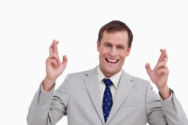 Κοντινό πλάνο χαμογελαστό επιχειρηματία με τα δάχτυλά του να διασχίσει — Φωτογραφία Αρχείου