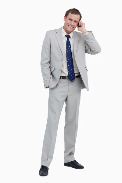 Smiling businessman on his mobile phone — Stock Photo, Image