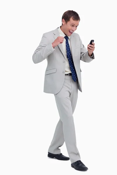Happy businessman getting good news via text message — Stock Photo, Image