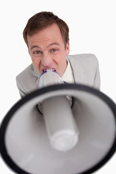 Businessman yelling through megaphone — Stock Photo, Image