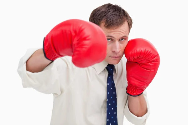 Striking businessman with boxing gloves — Stock Photo, Image