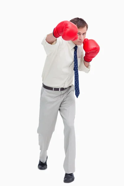 Businessman attacking with boxing gloves — Stock Photo, Image