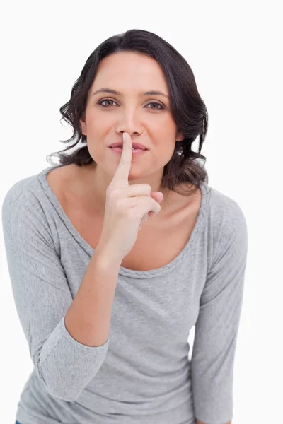 Close up of young woman asking for silence — Stock Photo, Image