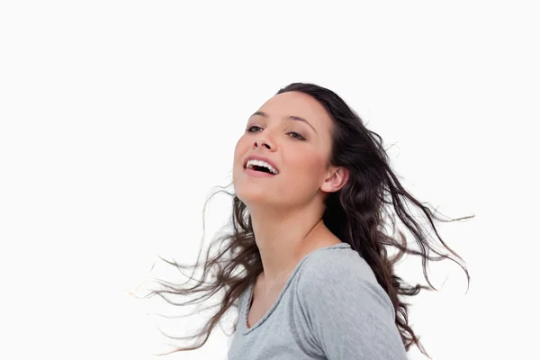 Woman standing against wind direction — Stock Photo, Image