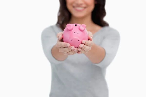Piggy bank being held by woman — Stock Photo, Image