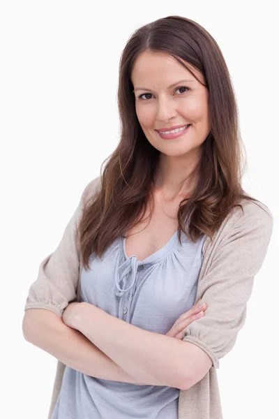 Close up of smiling woman with her arms crossed — Stock Photo, Image