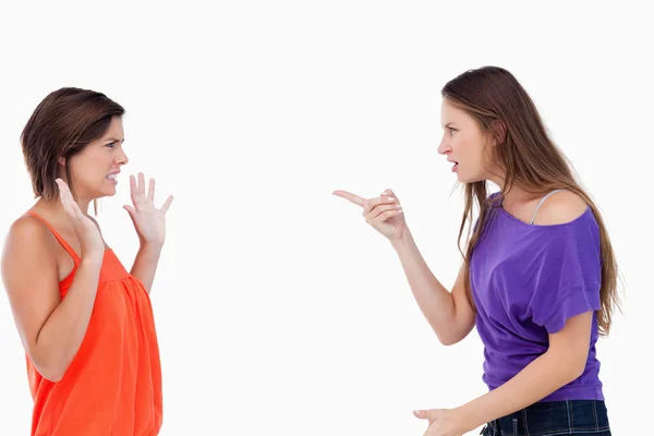Teenager blaming her friend who is claiming her innocence — Stock Photo, Image