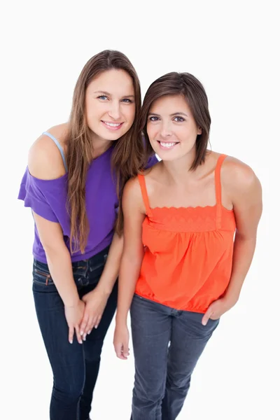 Two teenage girls leaning forward — Stock Photo, Image