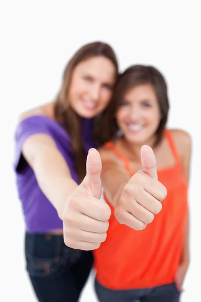Two thumbs up being showed by teenagers — Stock Photo, Image