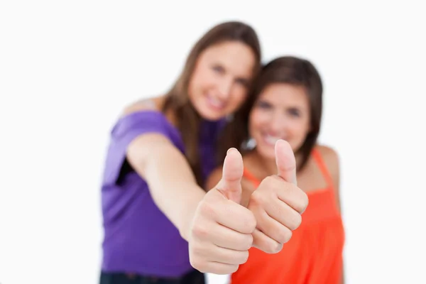 Thumbs up being showed by two friends while standing side by sid — Stock Photo, Image