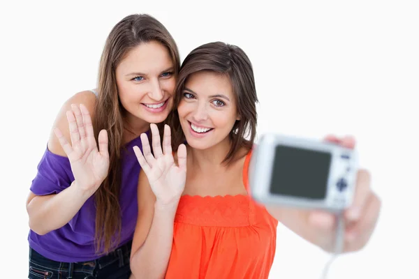 Teenagers waving for a digital camera — Stock Photo, Image