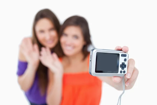 Digital camera taking a picture of two teenagers — Stock Photo, Image