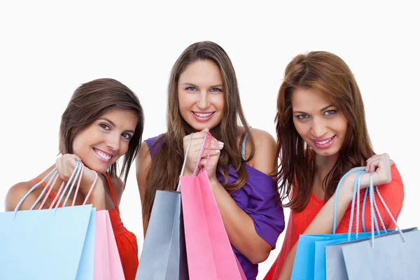 Teenage girls proudly coming back from shopping — Stock Photo, Image