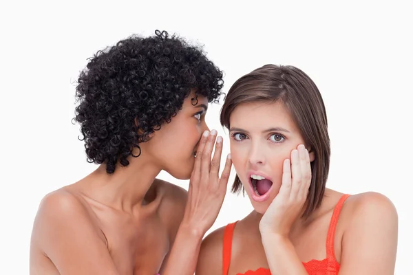 Teenager showing her surprise putting her hand on her cheek afte — Stock Photo, Image