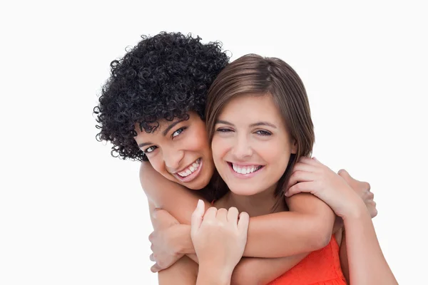 Teenager giving back hug to her friend — Stock Photo, Image
