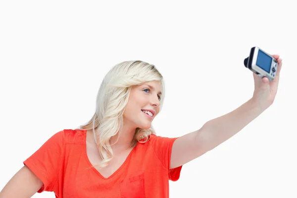 Smiling teenager photographing herself — Stock Photo, Image