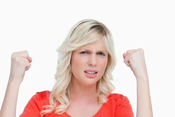 Young woman raising her fists showing her strength — Stock Photo, Image