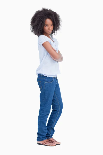 Side view of a serious young woman crossing her arms — Stock Photo, Image
