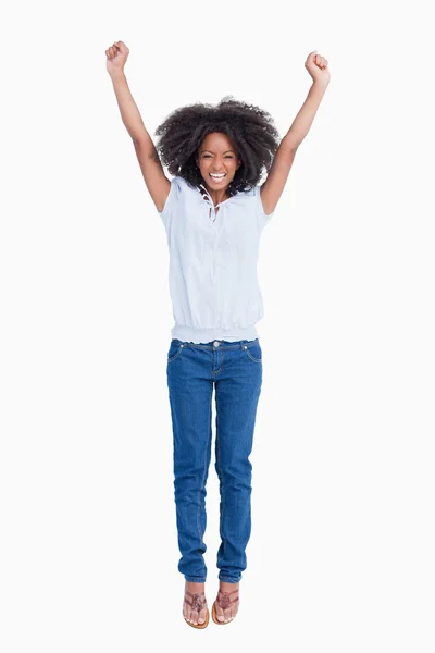 Young dynamic woman raising her arms above her head — Stock Photo, Image