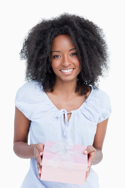 Happy young woman receiving a birthday gift — Stock Photo, Image