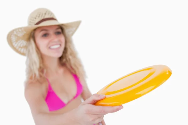 Frisbee held by an attractive woman — Stock Photo, Image