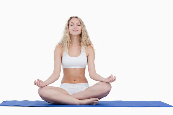 Young attractive woman doing yoga in sportswear — Stock Photo, Image