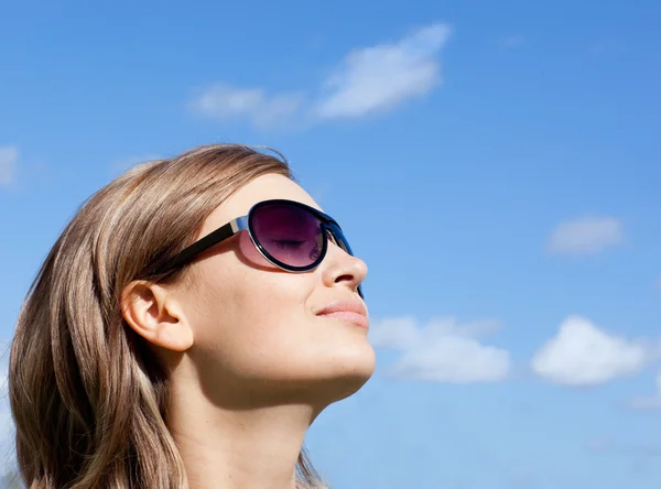 Young woman is wearing glasses outdoor Stock Image