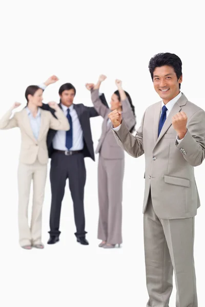 Successful businessman with cheering team — Stock Photo, Image
