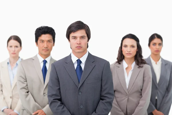 Serious salesteam standing together — Stock Photo, Image