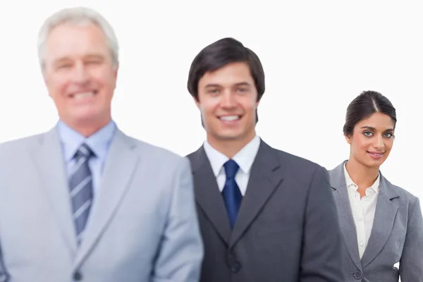 Smiling mature businessman with his employees Stock Photo