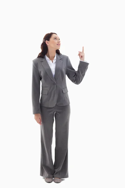 Businesswoman presenting a product on the top Stock Photo