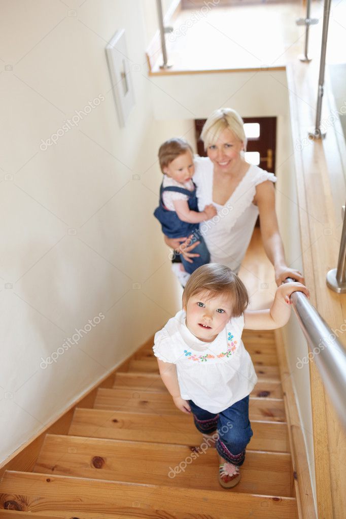 Family going upstairs Stock Photo by ©Wavebreakmedia 10320996