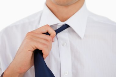 Close-up of a man undoing his tie clipart