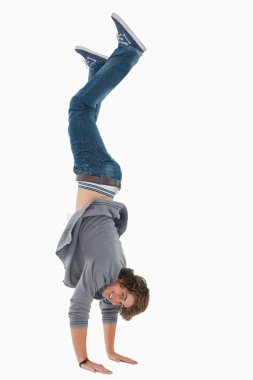 Male student posing handstands clipart