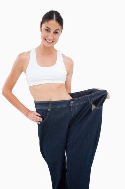 Young woman has lost a lot of weight clipart