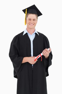 Man smiling as he has just graduated with his degree clipart