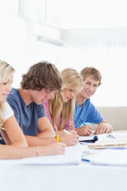 Close up of a student smiling as he looks at the camera while st clipart