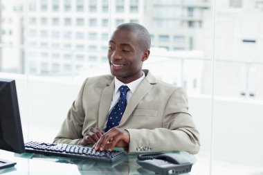 Entrepreneur using a computer clipart