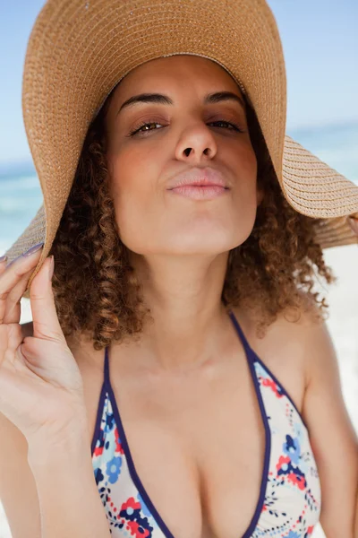 Young attractive woman standing upright with puckered lips — Stock Photo, Image