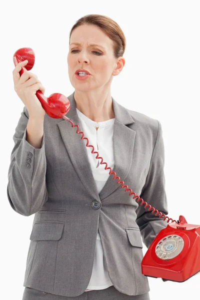 Angry businesswoman shouts at phone — Stock Photo, Image