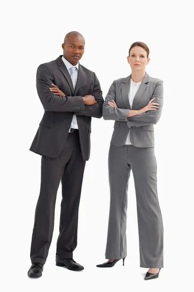 Hombre y mujer de negocios con las manos cruzadas — Foto de Stock