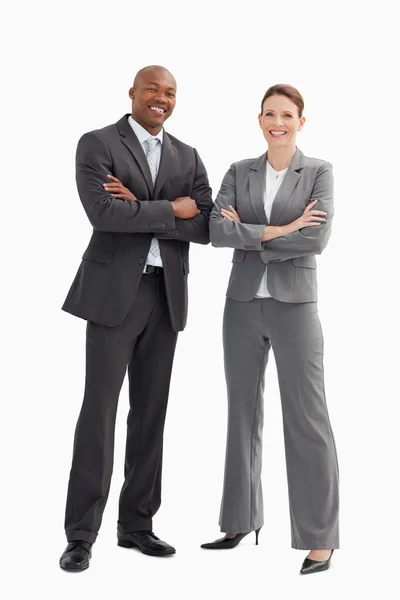 Smiling business man and woman posing — Stock Photo, Image