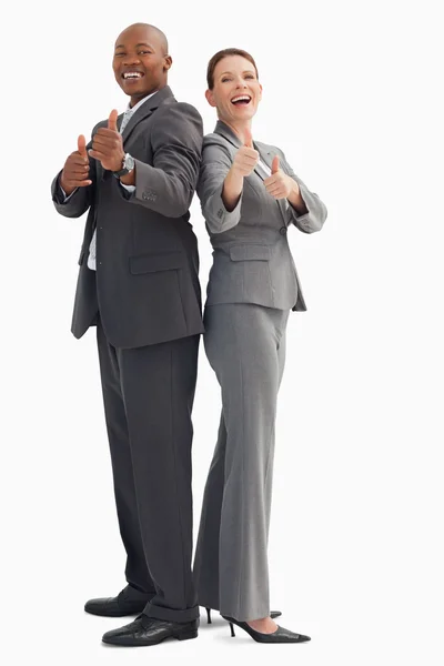 Smiling business with thumbs up — Stock Photo, Image