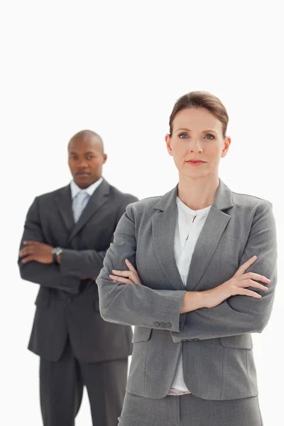 Serious businesswoman in front of businessman — Stock Photo, Image
